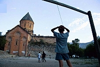 Turkey, near the border of Armenia. Children are playing football in the church yard.